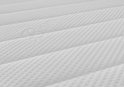 Gedetailleerd patroon van een wit topmatras met zachte ribbels en stippen, inclusief een ingeweven Easy Bedden logo.