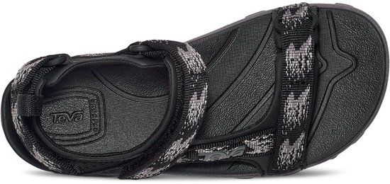 Zwarte Teva sandalen met grijs camouflagepatroon bandjes, bekeken vanaf de onderkant.