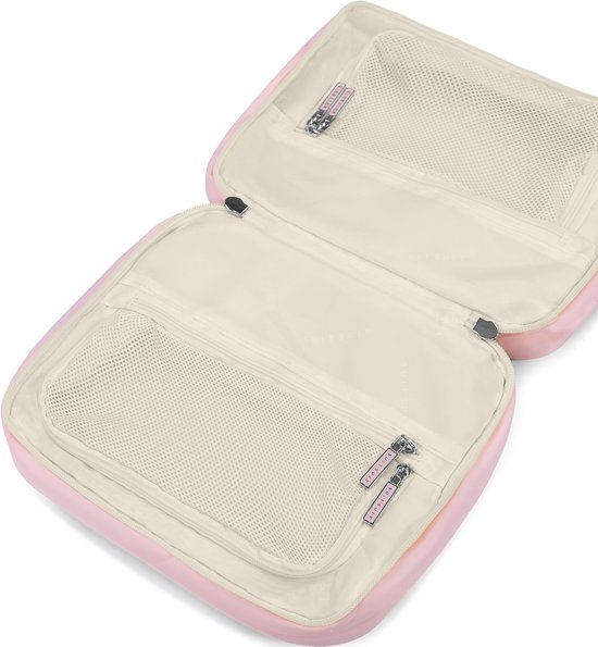 Open roze pastel SUITSUIT organizer met mesh vakken en zilveren ritsen.