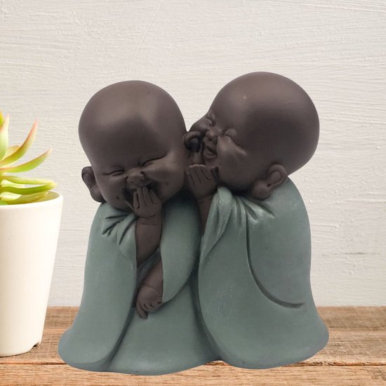 Statue de Bouddha riant amis