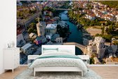 Behang - Fotobehang De Stari Most brug vanaf boven in Bosnië en Herzegovina - Breedte 320 cm x hoogte 240 cm