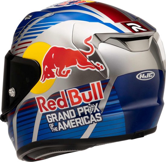 Zilverkleurige integraalhelm, zijaanzicht met Red Bull-logo, tekst Grand Prix of the Americas en gestreept patroon.