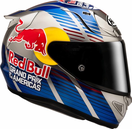 Zilverkleurige integraalhelm met Red Bull-logo, Grand Prix of the Americas-tekst en blauwe, rode en witte strepen.