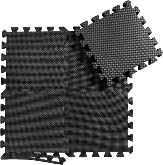 Vier zwarte puzzelmatten met een getextureerd oppervlak en inkepingen aan de randen, die in elkaar passen.