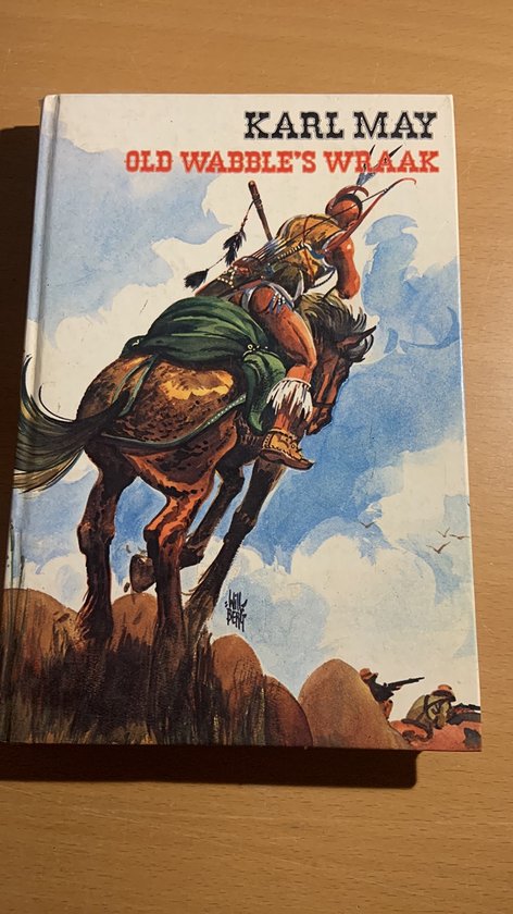 Boekcover met illustratie van een Indiaan te paard die vecht met een andere cowboy op een rotsachtige klif. Tekst: KARL MAY OLD WABBLE'S WRAAK.