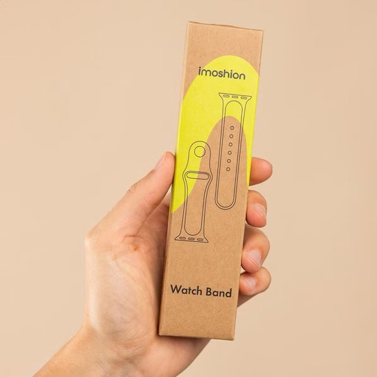 Hand die een kartonnen verpakking vasthoudt met de tekst 'imoshion' en 'Watch Band'. Illustraties van horlogebandjes.