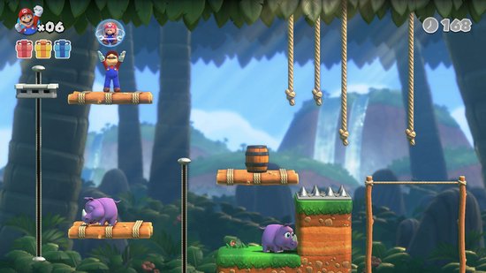Mario speelt in een jungle omgeving met platforms, touwen, een ton en paarse nijlpaardachtige wezens.