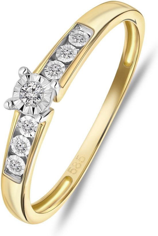 Bague en or avec sept diamants, avec '585' sur le corps.
