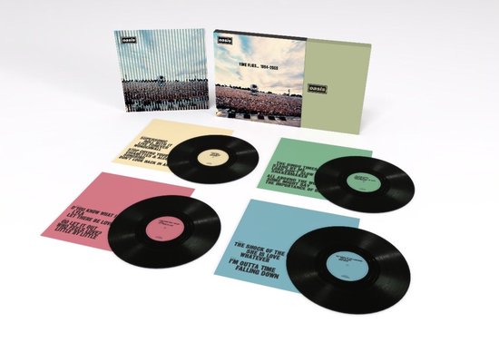 Box set met vier Oasis vinylplaten, 'Time Flies... 1994-2009'. Platenhoezen in groen, geel, roze en blauw.