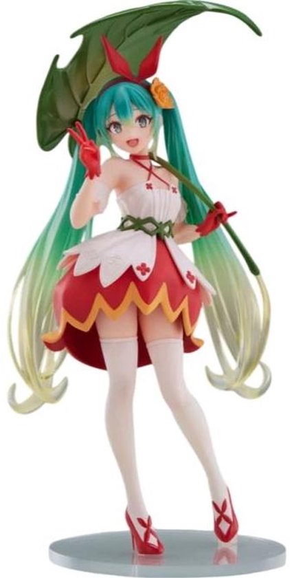Figurine de Hatsune Miku aux couettes vertes, robe blanche à accents rouges, feuille verte comme parapluie. Chaussures rouges.