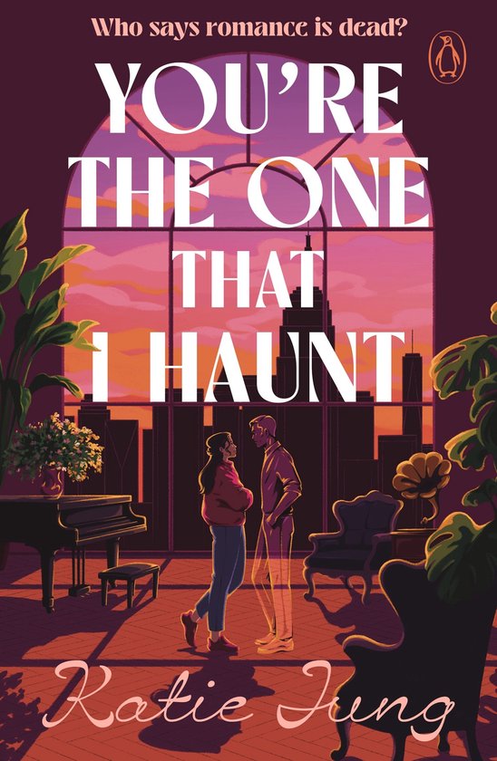 Couverture de livre 'YOU'RE THE ONE THAT I HAUNT' par Katie Jung. Un couple se fait face dans une pièce donnant sur un coucher de soleil.