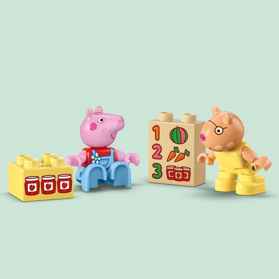 LEGO Duplo Peppa Pig Peppa en George met blokken met jam en cijfers.