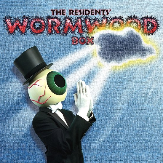 Een persoon met een oog als hoofd, gekleed in een zwart pak met top, strik en handschoenen, bidt onder een verlichte, donkere wolk. De tekst 'THE RESIDENTS' WORMWOOD BOX' staat bovenaan.