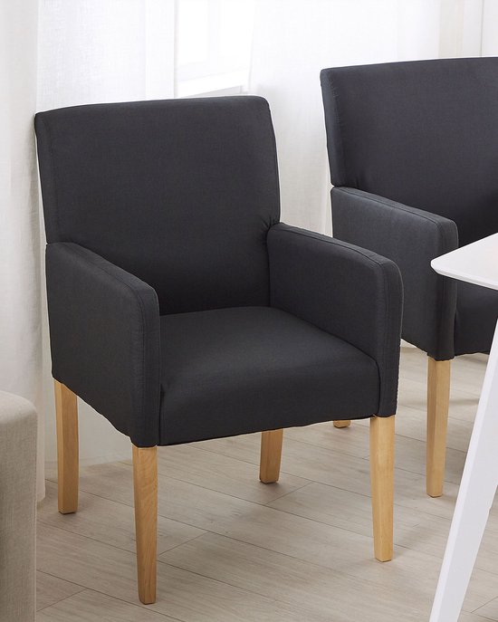 Chaise de salle à manger gris foncé avec rembourrage en tissu et pieds en bois.