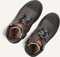 Twee donkerbruine leren veterboots met zwarte neus, zwart-witte veters en ritsen, bekeken van bovenaf.