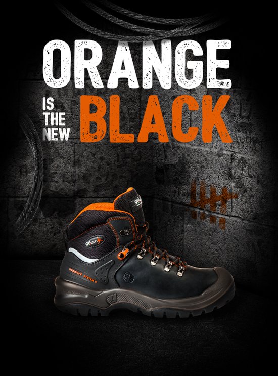 Zwarte Grisport werkschoen met oranje accenten en tekst 'Orange is the new black'.
