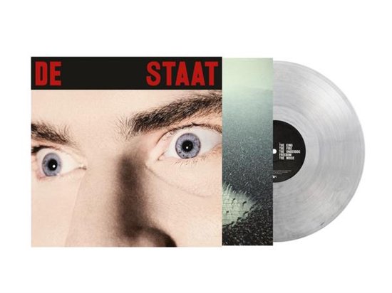 De Staat vinylalbum met hoes met close-up van ogen en transparante vinylplaat.