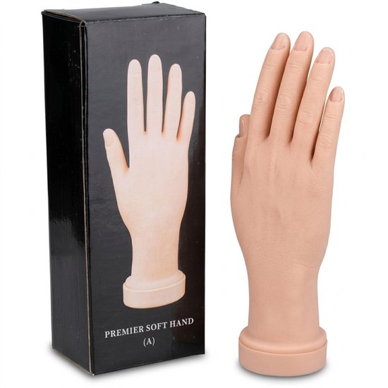 Main d'entraînement en silicone couleur chair à côté de la boîte noire marquée 'Premier Soft Hand (A)'.