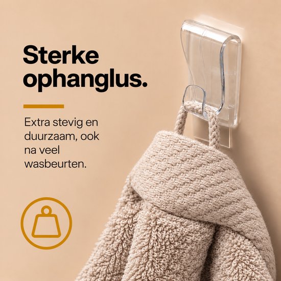 Close-up van een beige handdoek aan een stevige ophanglus, met de tekst: Extra stevig en duurzaam.