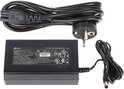 Zwarte TP-Link stroomadapter met kabel en Europese stekker. Label met input/output specificaties en veiligheidslogo's.