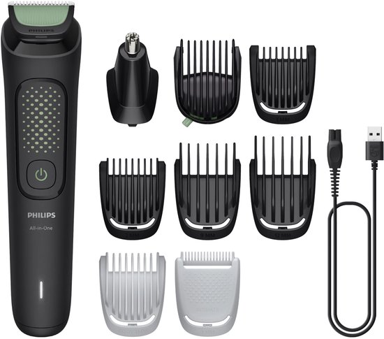 Zwarte Philips All-in-One trimmer met diverse opzetstukken voor neus, gezicht, haar en lichaam, en een USB-oplaadkabel.