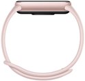 Zijkant van een lichtroze Xiaomi Smart Band met een smal, lichtroze bandje.