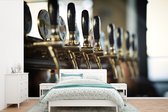 Behang - Fotobehang Meerdere biertappen op een bar - Breedte 390 cm x hoogte 260 cm