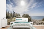 Behang - Fotobehang Zon - Wolken - Strand - Breedte 600 cm x hoogte 400 cm