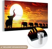 MuchoWow® Glasschilderij 120x60 cm - Schilderij acrylglas - Een illustratie van olifanten bij het landschap met een zonsondergang - Foto op glas - Schilderijen