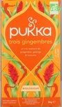 Pukka Trois Gingembres biologische kruidenthee, 20 zakjes met gember, galanga en kurkuma op oranje verpakking met botanische print.