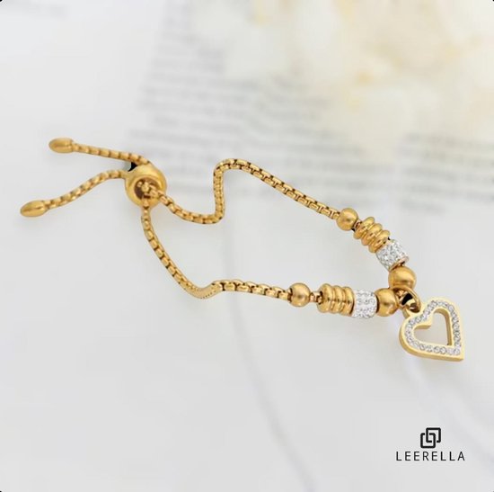 Gouden armband met schakelketting, kralen en een hartvormige hanger bezet met zirkonia.