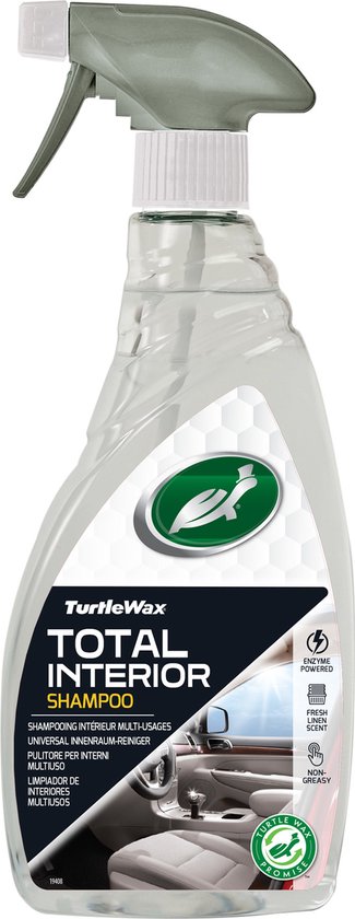 Bouteille de Turtle Wax Total Interior Shampoo avec bouchon vert. Montre une photo de l'intérieur d'une voiture avec un volant et un tableau de bord.