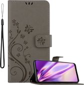 Cadorabo Hoesje geschikt voor Samsung Galaxy A22 4G / M22 / M32 4G in BLOEMEN GRIJS - Beschermhoes in bloemmotief met magnetische sluiting, standfunctie en kaartsleuven Book Case Cover Etui