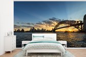 Behang - Fotobehang Zonnestralen over de brug van Sydney - Breedte 405 cm x hoogte 260 cm