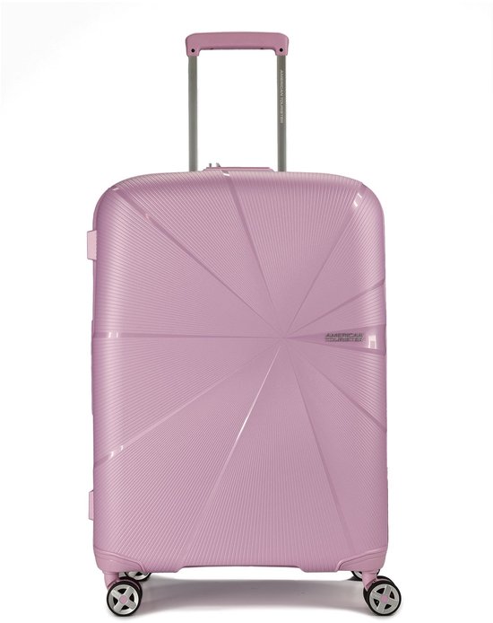 Roze American Tourister koffer met sterpatroon, uitschuifbaar handvat en wielen.