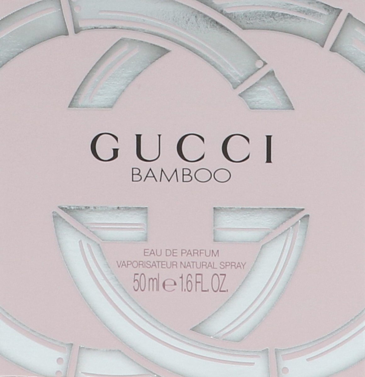 Een glazen Gucci Bamboo parfumfles met zilveren dop.