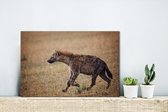 Canvas Schilderij Hyena - Gras - Jacht - 30x20 cm - Wanddecoratie