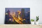 Canvas Schilderij Schitterende verlichting in de starten van de Chinese stad Changchun - 30x20 cm - Wanddecoratie