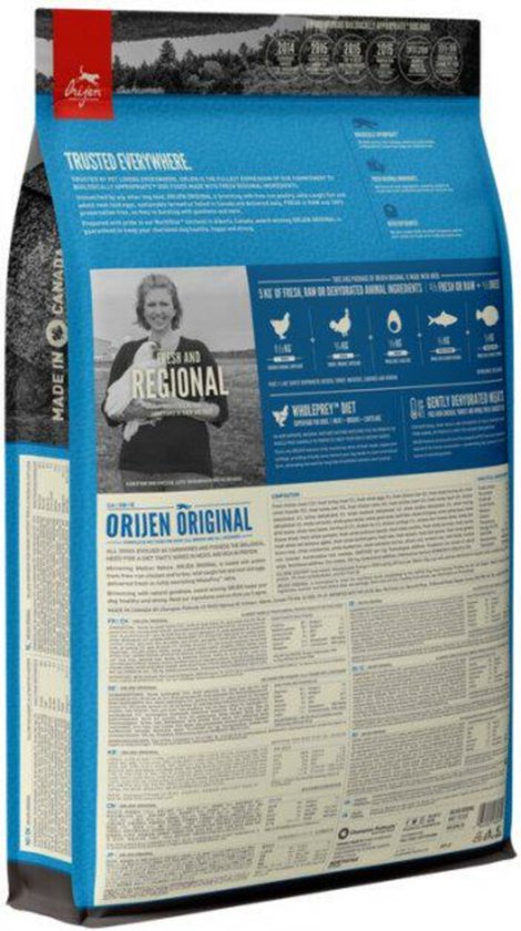 Orijen Original hondenvoer zak met een foto van een vrouw en tekst 'Fresh and Regional'.