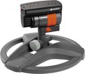 Arroseur oscillant GARDENA compact avec anneaux orange et têtes d'arrosage, sur une base noire.