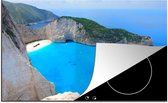 KitchenYeah® Inductie beschermer 76x51.5 cm - Zicht op de knalblauwe zee en het witte strand van Navagio Beach - Kookplaataccessoires - Afdekplaat voor kookplaat - Inductiebeschermer - Inductiemat - Inductieplaat mat