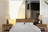 Behang - Fotobehang Vrachtwagen op een onverharde weg - Breedte 300 cm x hoogte 300 cm