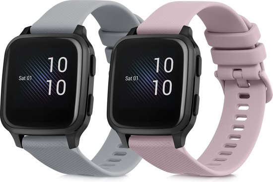 Twee smartwatches, één met een grijs bandje en één met een oudroze bandje, beide met zwarte behuizing.