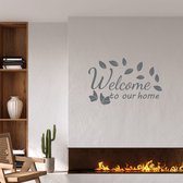 Stickerheld - Muursticker "Welcome to our home" Quote - Woonkamer - decoratie - Engelse Teksten - Mat Donkergrijs - 55x84cm