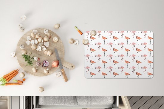 Set de table avec un motif blanc de flamants roses debout.