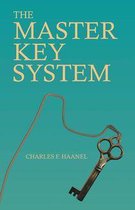 Boek "The Master Key System" met een oud uitziende sleutel aan een touwtje.