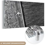 MuchoWow® Glasschilderij 80x40 cm - Schilderij acrylglas - Vliegtuig - Zee - Landschap - Foto op glas - Schilderijen