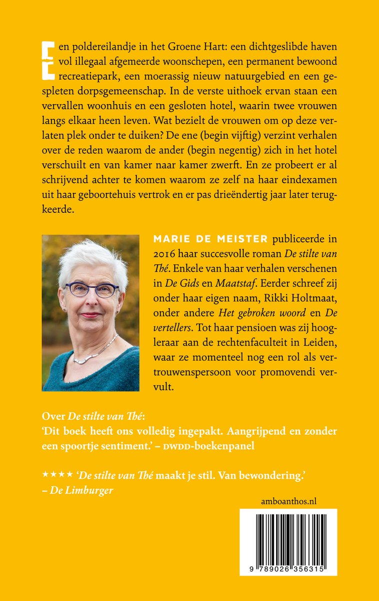 Portret van Marie de Meester met grijzend haar, bril en een blauwe trui.