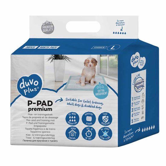Duvo+ P-PAD premium L, 45x60cm, 30 stuks. Een puppy staat op een witte en lichtblauwe plasmat. Beschrijving van het product met absorptiekenmerken.