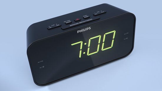 Zwarte Philips wekkerradio met groene digitale tijd, close-up van de bovenkant met knoppen.